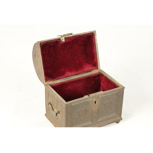 725 - A 19TH CENTURY CAST IRON JEWELLERY CASKET having a hinged domed lid with panelled foliate decoration... 