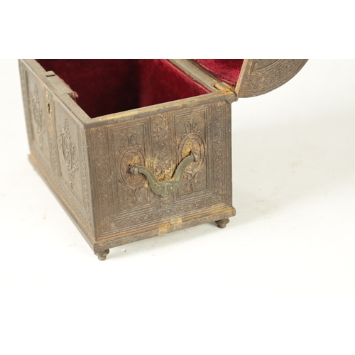 725 - A 19TH CENTURY CAST IRON JEWELLERY CASKET having a hinged domed lid with panelled foliate decoration... 