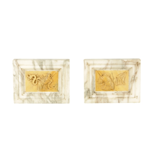 727 - A PAIR OF GRAND TOUR-STYLE WHITE AND SIENNA MARBLE PLAQUES decorated with Roman style armour (16.5cm... 