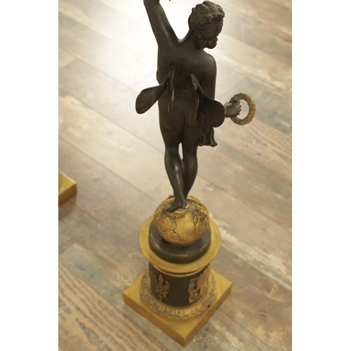 728 - A GOOD PAIR OF REGENCY STYLE BRONZE AND GILT BRONZE FIGURAL LAMP BASES of classical style with stand... 