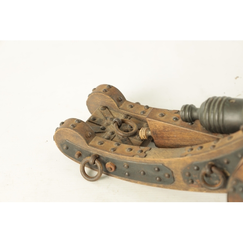 732 - A 20TH CENTURY BRONZE MODEL OF A CANNON mounted on a wooden carriage with steel decoration (37cm wid... 