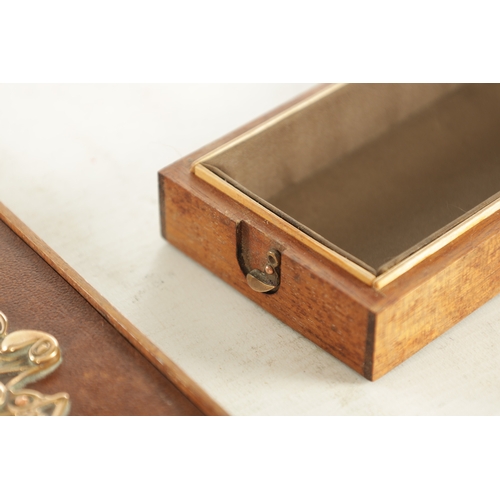 733 - AN ART DECO MIXED MEDIA LIDDED BOX with Mahogany carcass and leather inlaid top fitted with a stylis... 