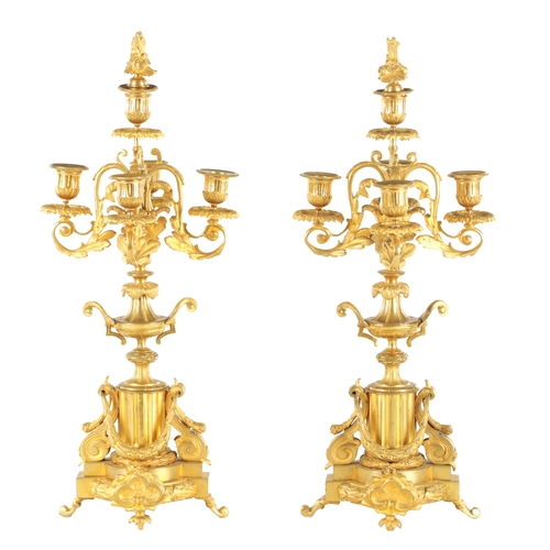 748 - A PAIR OF LATE 19TH CENTURY FRENCH ORMOLU CANDELABRA with five leaf work branches raised on urn-shap... 