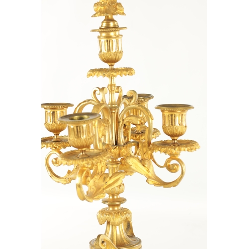 748 - A PAIR OF LATE 19TH CENTURY FRENCH ORMOLU CANDELABRA with five leaf work branches raised on urn-shap... 