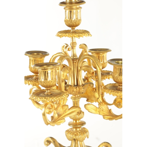 748 - A PAIR OF LATE 19TH CENTURY FRENCH ORMOLU CANDELABRA with five leaf work branches raised on urn-shap... 