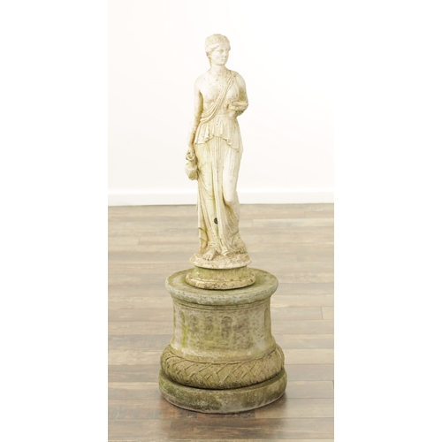 752 - A CARVED WHITE LIMESTONE OF A MAIDEN in classical dress mounted on a circular plinth base.