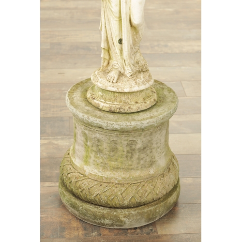 752 - A CARVED WHITE LIMESTONE OF A MAIDEN in classical dress mounted on a circular plinth base.