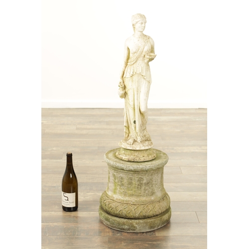 752 - A CARVED WHITE LIMESTONE OF A MAIDEN in classical dress mounted on a circular plinth base.