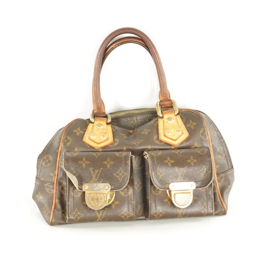 753 - A GENUINE LOUIS VUITTON MANHATTAN LEATHER HANDBAG with monogrammed decoration. (32cm wide, 18cm high... 