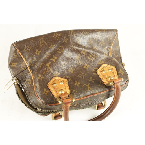 753 - A GENUINE LOUIS VUITTON MANHATTAN LEATHER HANDBAG with monogrammed decoration. (32cm wide, 18cm high... 