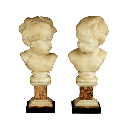 758 - A PAIR OF GEORGE III CARVED WHITE MARBLE BUSTS OF PUTTI raised on marble square plinth bases (38cm h... 