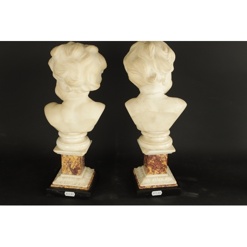 758 - A PAIR OF GEORGE III CARVED WHITE MARBLE BUSTS OF PUTTI raised on marble square plinth bases (38cm h... 