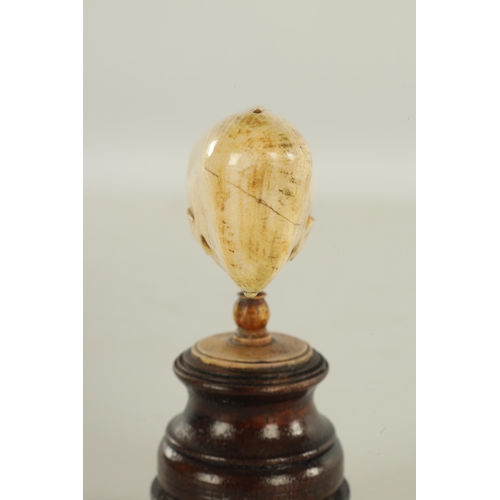 759 - A 19TH CENTURY SCRIMSHAW-CARVED MARINE IVORY SCULPTURE MODELLED AS A SPERM WHALE mounted on a turned... 