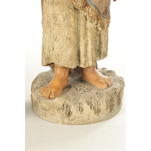 765 - A LARGE PAIR OF 19TH CENTURY POLYCHROME TERRACOTTA FIGURES modelled as a young boy and girl on natur... 