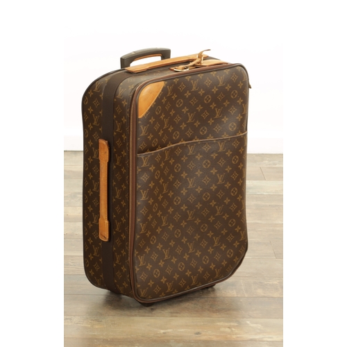 766 - A GENUINE LOUIS VUITTON CABIN SUITCASE with monogrammed decoration and brown leather carrying handle... 