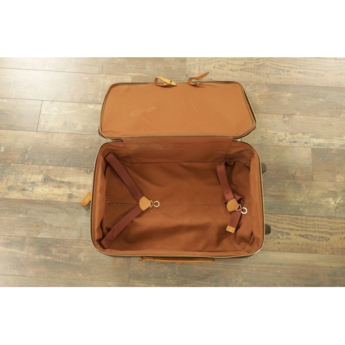 766 - A GENUINE LOUIS VUITTON CABIN SUITCASE with monogrammed decoration and brown leather carrying handle... 