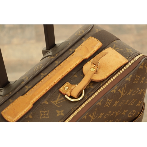 766 - A GENUINE LOUIS VUITTON CABIN SUITCASE with monogrammed decoration and brown leather carrying handle... 