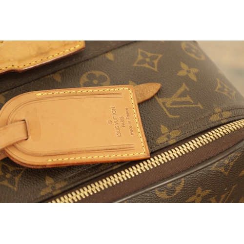 766 - A GENUINE LOUIS VUITTON CABIN SUITCASE with monogrammed decoration and brown leather carrying handle... 