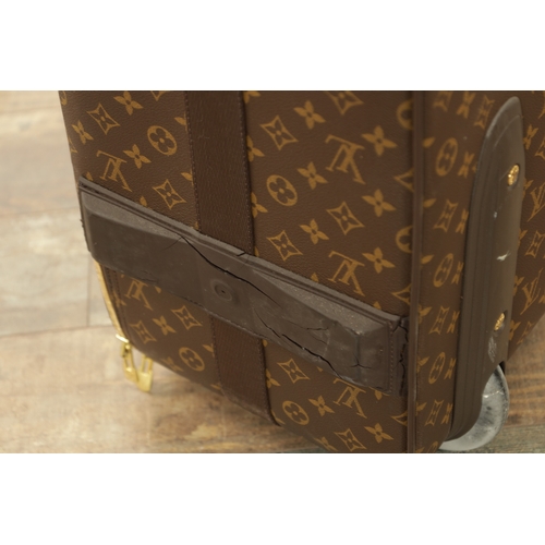 766 - A GENUINE LOUIS VUITTON CABIN SUITCASE with monogrammed decoration and brown leather carrying handle... 