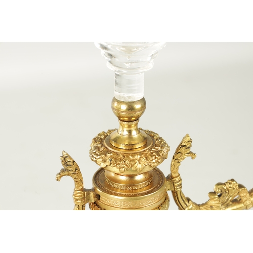 776 - A PAIR OF LATE 19TH CENTURY REGENCY STYLE FRENCH ORMOLU AND CUT GLASS CANDELABRA with twin candle sc... 