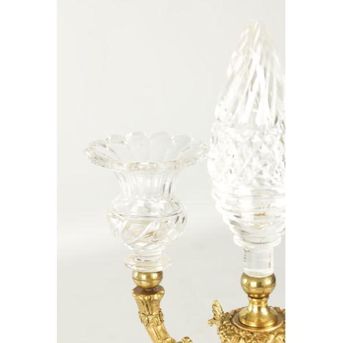 776 - A PAIR OF LATE 19TH CENTURY REGENCY STYLE FRENCH ORMOLU AND CUT GLASS CANDELABRA with twin candle sc... 