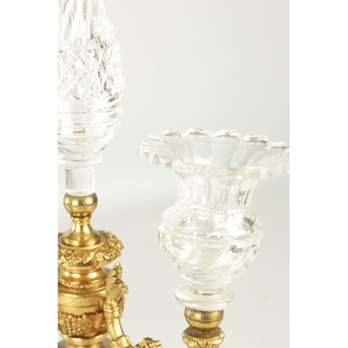 776 - A PAIR OF LATE 19TH CENTURY REGENCY STYLE FRENCH ORMOLU AND CUT GLASS CANDELABRA with twin candle sc... 