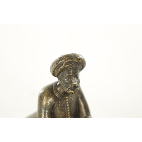 778 - A LATE 19TH CENTURY BERGMAN-TYPE EASTERN BRONZE SCULPTURE. modelled as a seated snake charmer figure... 