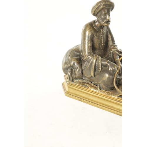 778 - A LATE 19TH CENTURY BERGMAN-TYPE EASTERN BRONZE SCULPTURE. modelled as a seated snake charmer figure... 