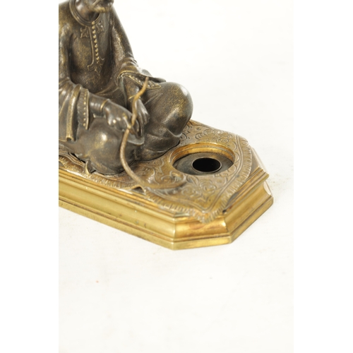 778 - A LATE 19TH CENTURY BERGMAN-TYPE EASTERN BRONZE SCULPTURE. modelled as a seated snake charmer figure... 