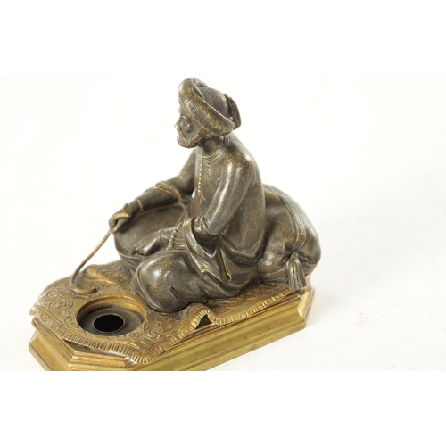 778 - A LATE 19TH CENTURY BERGMAN-TYPE EASTERN BRONZE SCULPTURE. modelled as a seated snake charmer figure... 