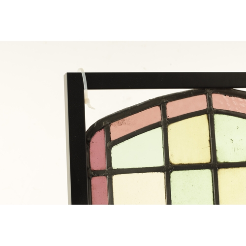 779 - A LATE 19TH CENTURY LEADED COLOURED STAIN GLASS WINDOW of square panels enclosing a central bird and... 