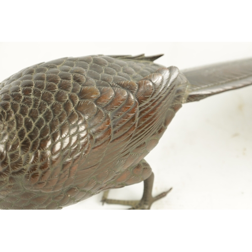 786 - A 19TH CENTURY BRONZE BIRD SCULPTURE of a standing pheasant (44.5cm length and 15cm high)