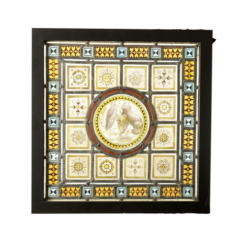 790 - A LATE 19TH CENTURY COLOURED STAIN GLASS WINDOW of leaded differing geometric designs enclosing a ce... 