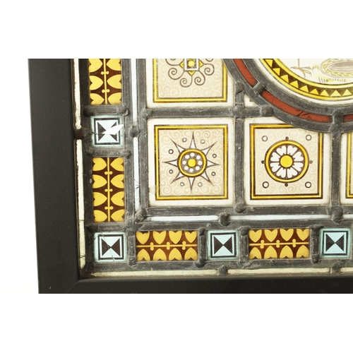 790 - A LATE 19TH CENTURY COLOURED STAIN GLASS WINDOW of leaded differing geometric designs enclosing a ce... 