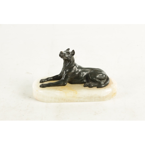 791 - A 19TH CENTURY FRENCH BRONZE AND WHITE ONYX RECUMBENT DOG DESK PAPERWEIGHT with dark green patinated... 