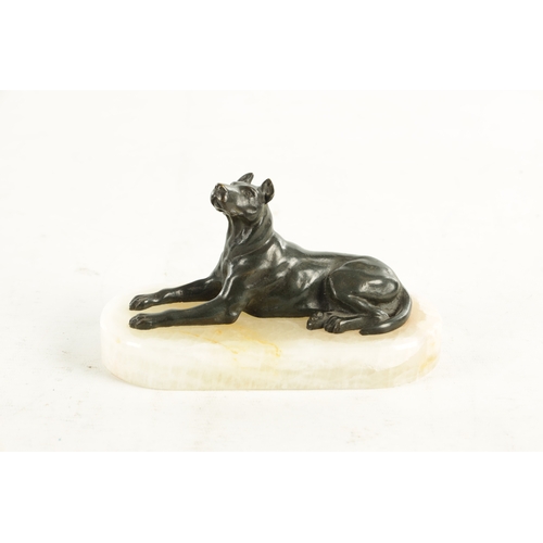 791 - A 19TH CENTURY FRENCH BRONZE AND WHITE ONYX RECUMBENT DOG DESK PAPERWEIGHT with dark green patinated... 