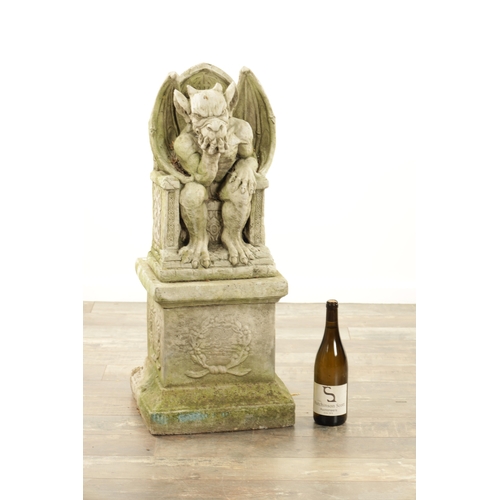 795 - A MODERN COMPOSITE STONE GARDEN STATUE MODELLED AS THE DEVIL seated in a chair raised on a square pl... 