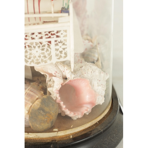 801 - A 20TH CENTURY CHINESE CANTONESE CARVED BONE DIARAMA under a glass dome finely pierced with standing... 