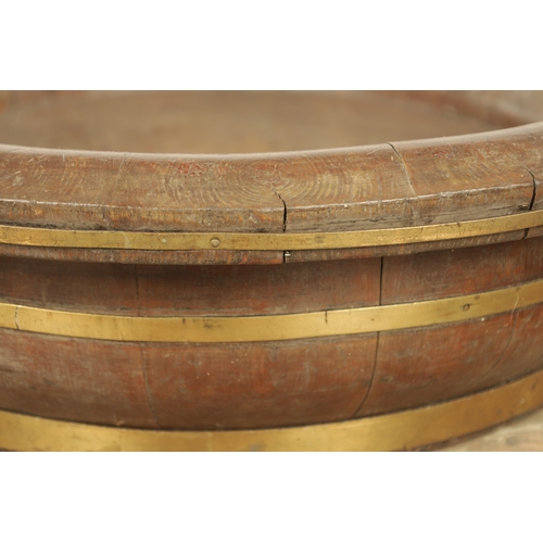 885 - A LARGE 19TH CENTURY PITCH PINE COOPERED BOWL OF LARGE SIZE with shaped sides and brass bands (77cm ... 