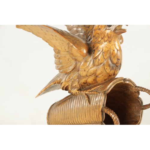 889 - A 19TH CENTURY BLACK FOREST CARVED LINDEN WOOD SCULPTURE depicting a bird sat on a basket - with gla... 