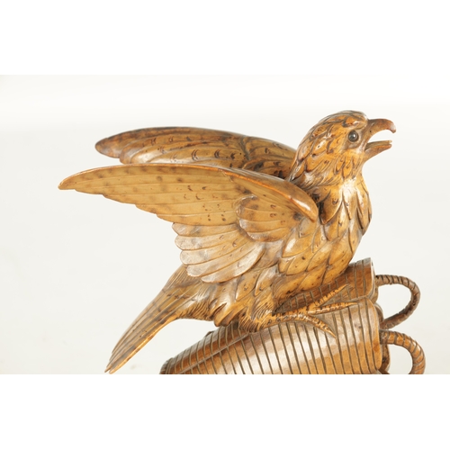 889 - A 19TH CENTURY BLACK FOREST CARVED LINDEN WOOD SCULPTURE depicting a bird sat on a basket - with gla... 