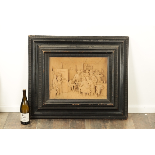 893 - A FINE EARLY 19TH CENTURY CONTINENTAL CARVED LIME WOOD TAVERN SCENE in a moulded ebonised frame (36c... 