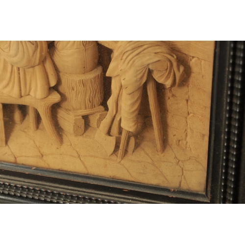 893 - A FINE EARLY 19TH CENTURY CONTINENTAL CARVED LIME WOOD TAVERN SCENE in a moulded ebonised frame (36c... 