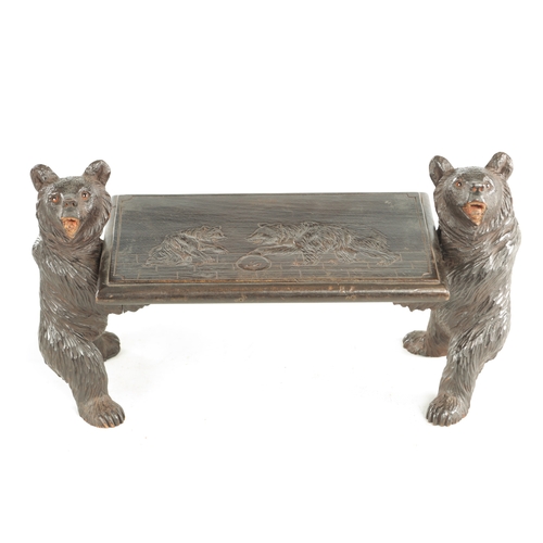 898 - A 19TH CENTURY CARVED LINDEN WOOD BLACK FOREST CHILDS STOOL having two standing bears holding a carv... 