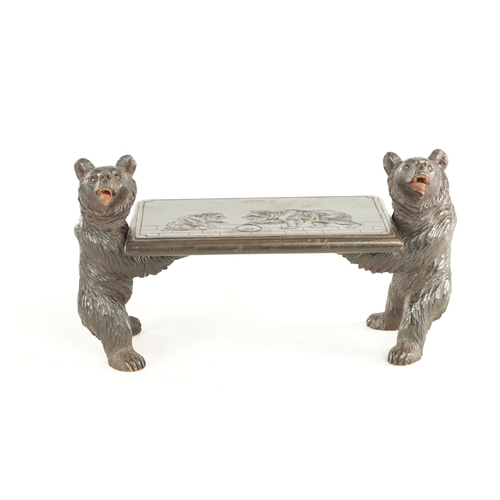 898 - A 19TH CENTURY CARVED LINDEN WOOD BLACK FOREST CHILDS STOOL having two standing bears holding a carv... 