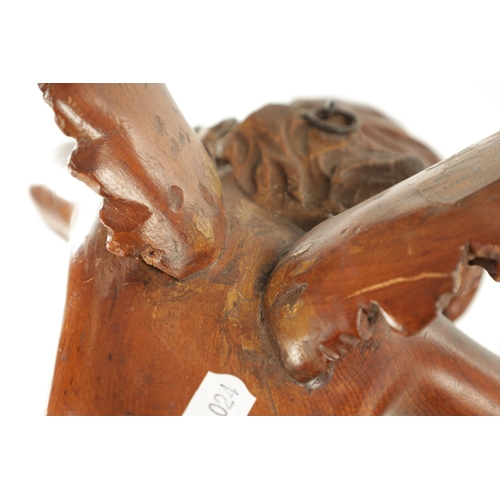 908 - A 19TH CENTURY ITALIAN CARVED WALNUT SCULPTURE of a winged cherub (37cm high 28cm wide )