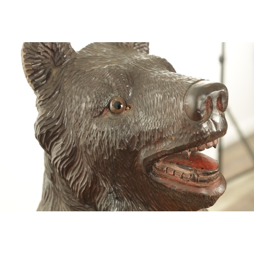 910 - A LATE 19TH CENTURY CARVED BLACK FOREST BEAR AND CUB STICK STAND modelled as a standing bear with he... 