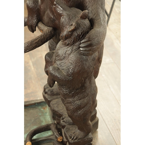 910 - A LATE 19TH CENTURY CARVED BLACK FOREST BEAR AND CUB STICK STAND modelled as a standing bear with he... 