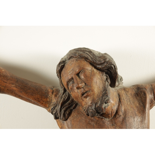 915 - AN EARLY 15TH/16TH CENTURY CONTINENTAL CARVED OAK AND POLYCHROME CORPUS CHRISTI. (108cm high, 92cm w... 