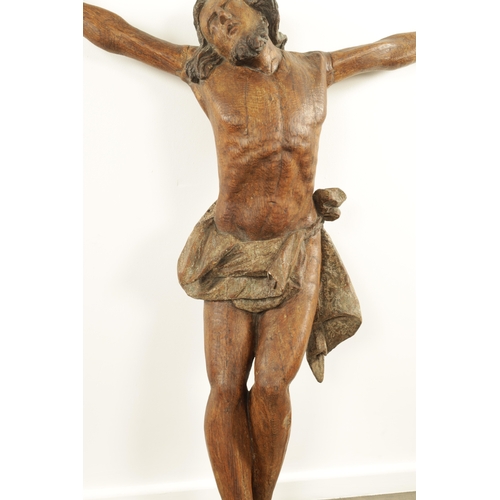 915 - AN EARLY 15TH/16TH CENTURY CONTINENTAL CARVED OAK AND POLYCHROME CORPUS CHRISTI. (108cm high, 92cm w... 